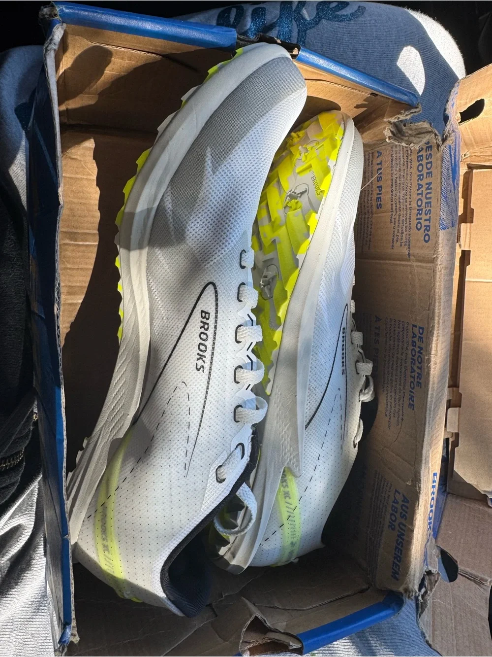 Brooks Unisex White Athletic Shoe with Neon Yellow Accents